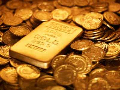 الذهب يتراجع مع تماسك الدولار ويتحرك في نطاق ضيق 