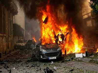مقتل 13 وإصابة 55 بانفجار خمس سيارات في بغداد 